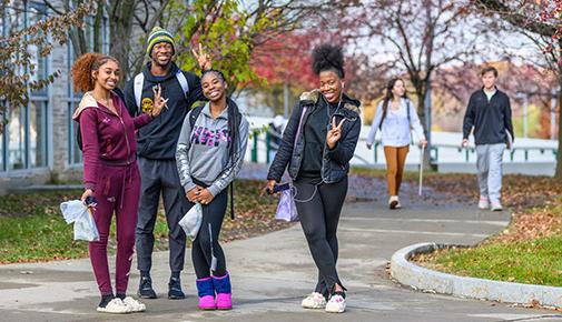 Students outside on campus in the fall